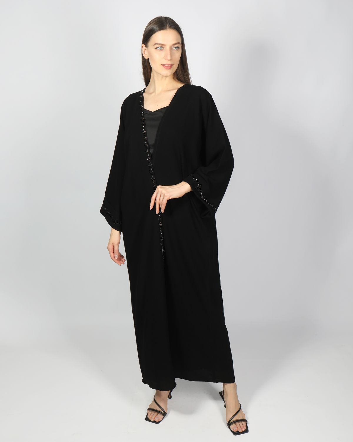 Woman wearing a black nida abaya
