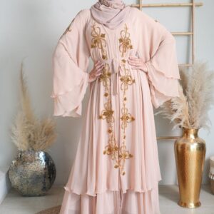 Woman in a rose pink embroidered abaya with beige headscarf - Eid Edit Embellished Abaya in rose taupe
