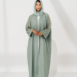 Woman in a deep emerald green abaya - Layali Silk-Blend Abaya in deep emerald