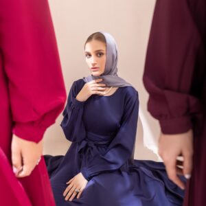Woman in a deep navy abaya - Minimal Button-Front Abaya in deep navy
