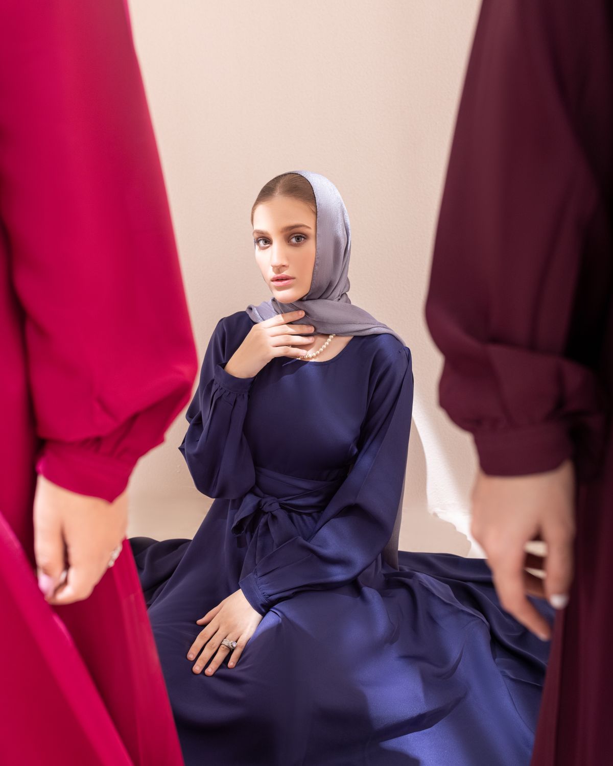 Woman in a deep navy abaya - Minimal Button-Front Abaya in deep navy