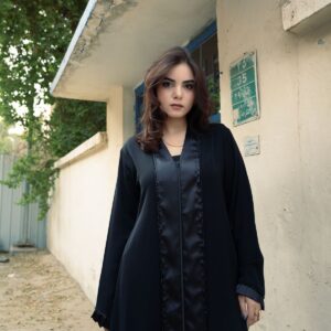 Woman in a charcoal flared abaya - Soft Flare Nida Abaya