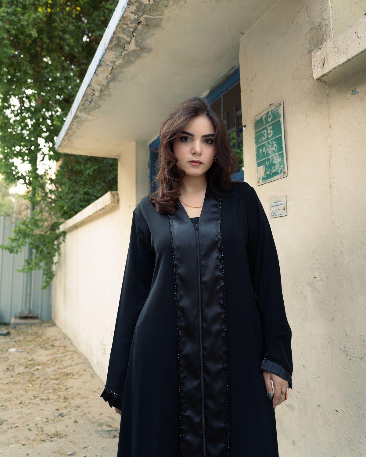 Woman in a charcoal flared abaya - Soft Flare Nida Abaya