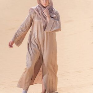 Woman in a light ivory abaya outdoors - Classic Nida Abaya in ivory